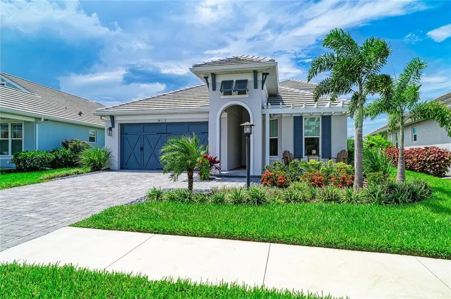 Front exterior of a new home in , Sarasota, FL, highlighting curb appeal (Image 2). Front exterior of a new home in , Sarasota, FL, highlighting curb appeal (Image 2).