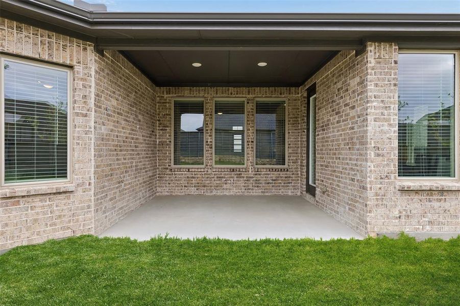 Exterior details and patio area of a home in , Little Elm (Image 24).
