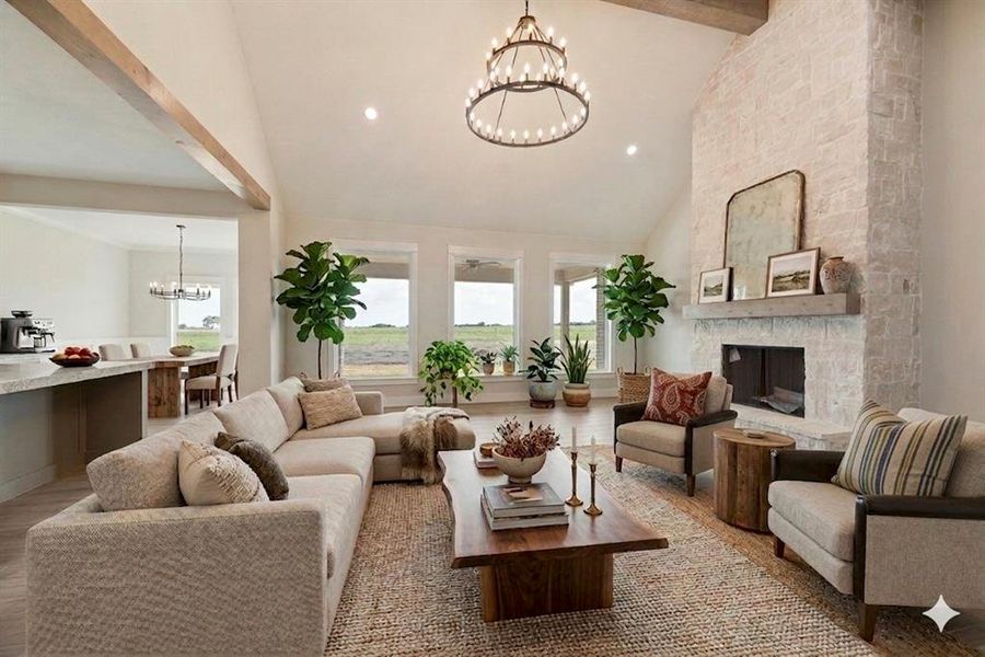 Living room featuring a chandelier, lofted ceiling, wood finished floors, and a fireplace