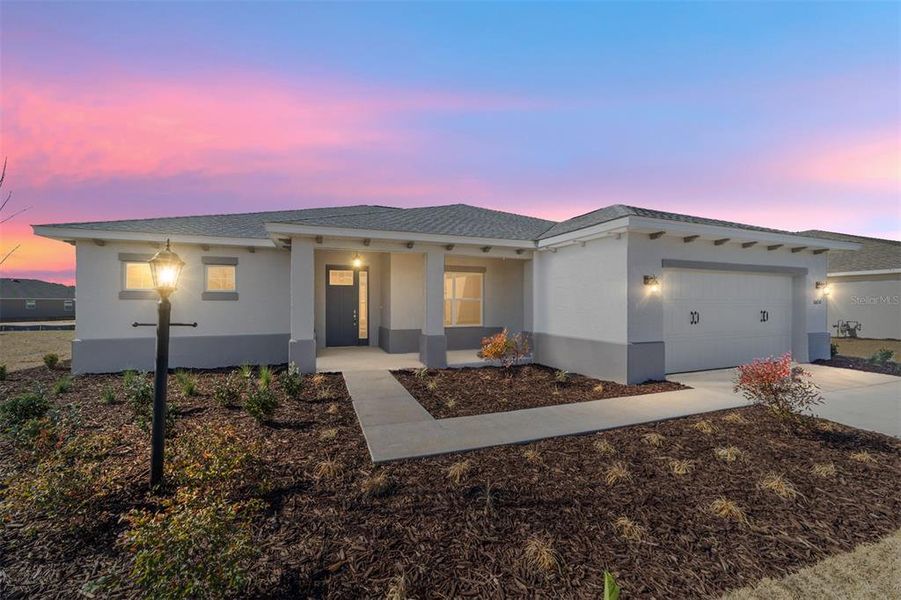 Front exterior of a new home in On Top of the World Communities, Ocala, FL, highlighting curb appeal (Image 21).