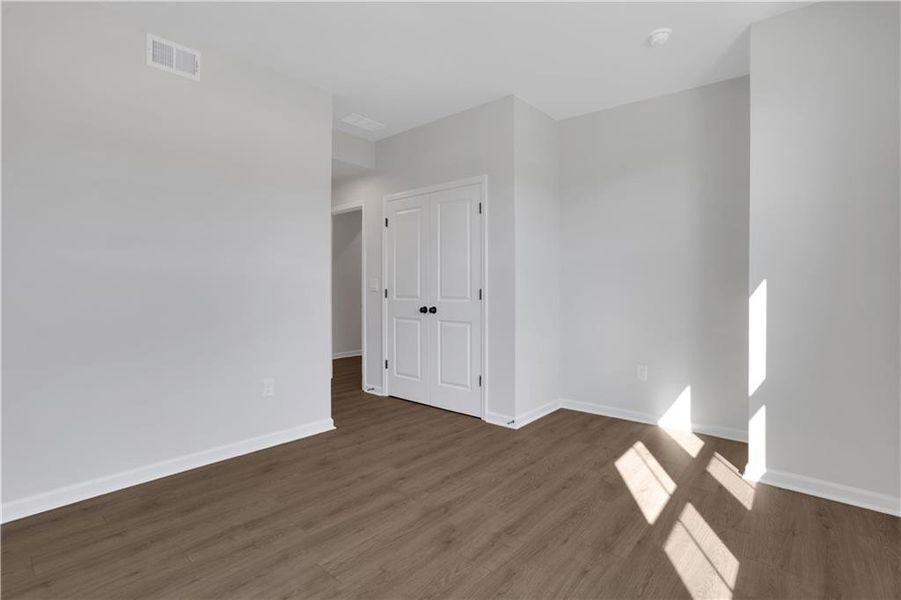 Spacious, unfurnished interior of a new home in The Paddocks at Doc Hughes, Buford (Image 42).