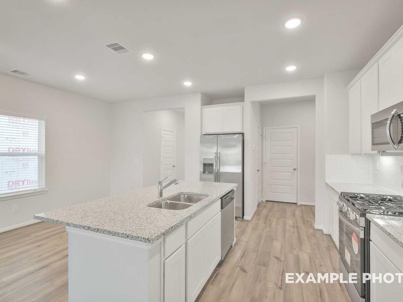 Furnished interior view inside a new home in Caney Creek Place, Conroe (Image 4).