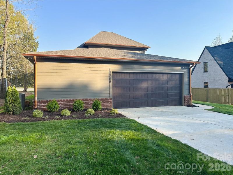 Front exterior of a new home in , Matthews, NC, highlighting curb appeal (Image 1). Front exterior of a new home in , Matthews, NC, highlighting curb appeal (Image 1).