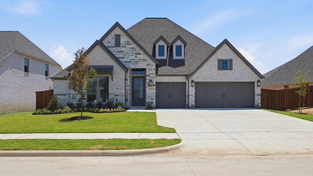 Front exterior of a new home in Myrtle Creek, Waxahachie, TX, highlighting curb appeal (Image 1). Front exterior of a new home in Myrtle Creek, Waxahachie, TX, highlighting curb appeal (Image 1).