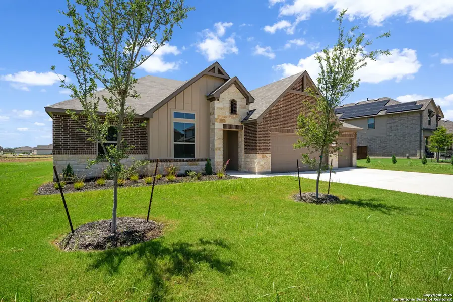 Front exterior of a new home in Annabelle Ranch, San Antonio, TX, highlighting curb appeal (Image 1). Front exterior of a new home in Annabelle Ranch, San Antonio, TX, highlighting curb appeal (Image 1).