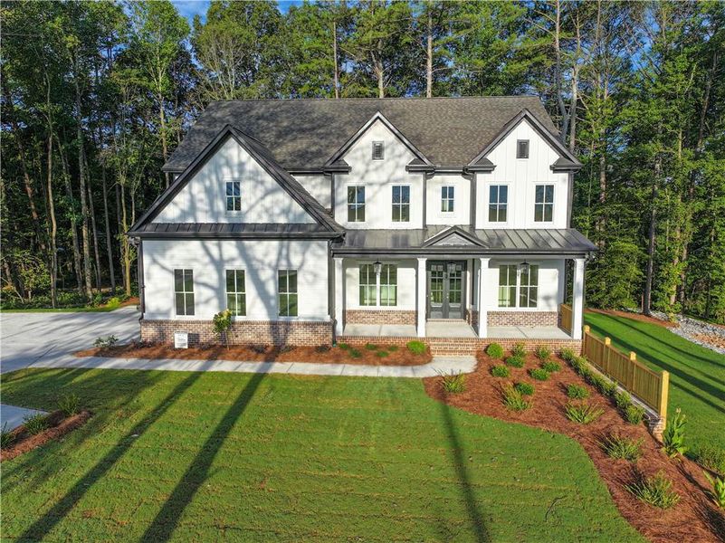 Front exterior of a new home in , Cumming, GA, highlighting curb appeal (Image 35). Front exterior of a new home in , Cumming, GA, highlighting curb appeal (Image 35).