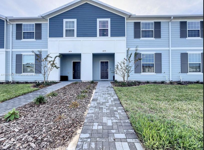 Front exterior of a new home in , Davenport, FL, highlighting curb appeal (Image 20).