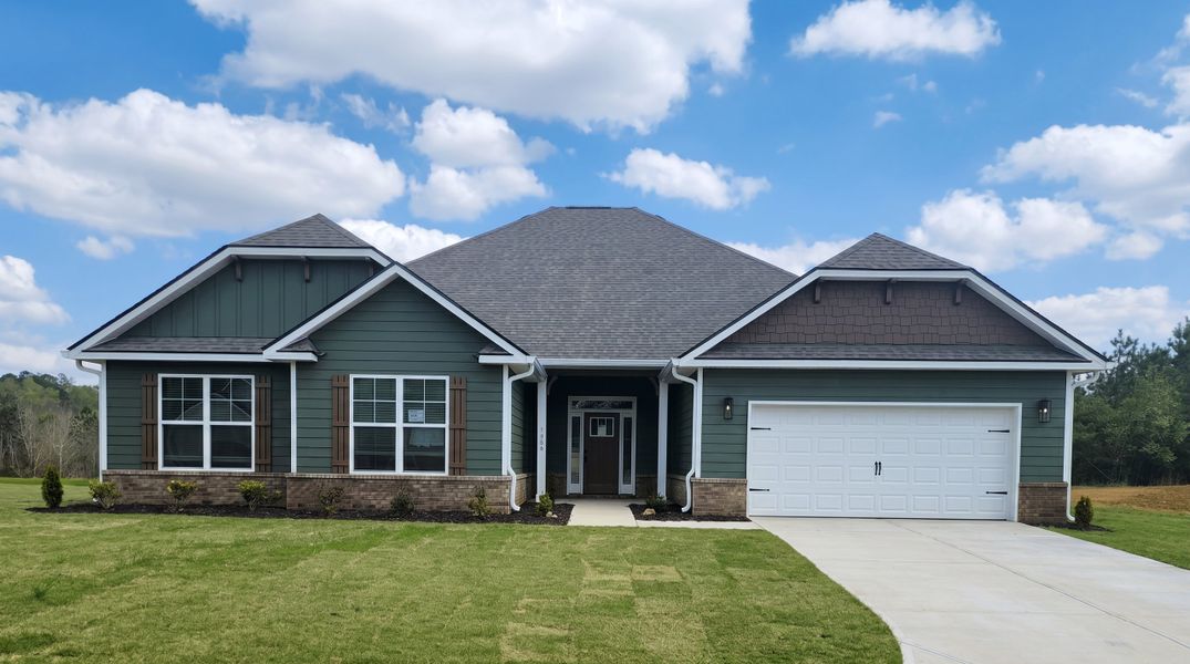 Front exterior of a new home in Holliday Pass, Griffin, GA, highlighting curb appeal (Image 1). Front exterior of a new home in Holliday Pass, Griffin, GA, highlighting curb appeal (Image 1).