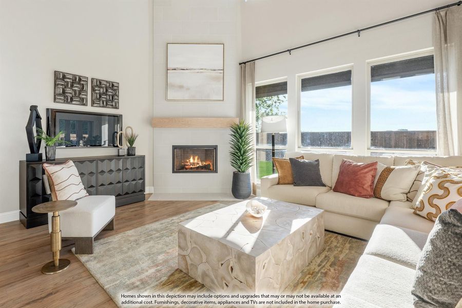 Bright living room with high ceilings, gas fireplace, sectional sofa, and large windows with natural light. Bright living room with high ceilings, gas fireplace, sectional sofa, and large windows with natural light.