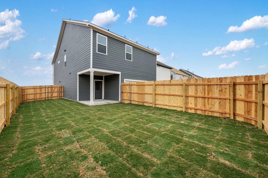 Exterior details and patio area of a home in The Cottages at Lariat, Liberty Hill (Image 29).