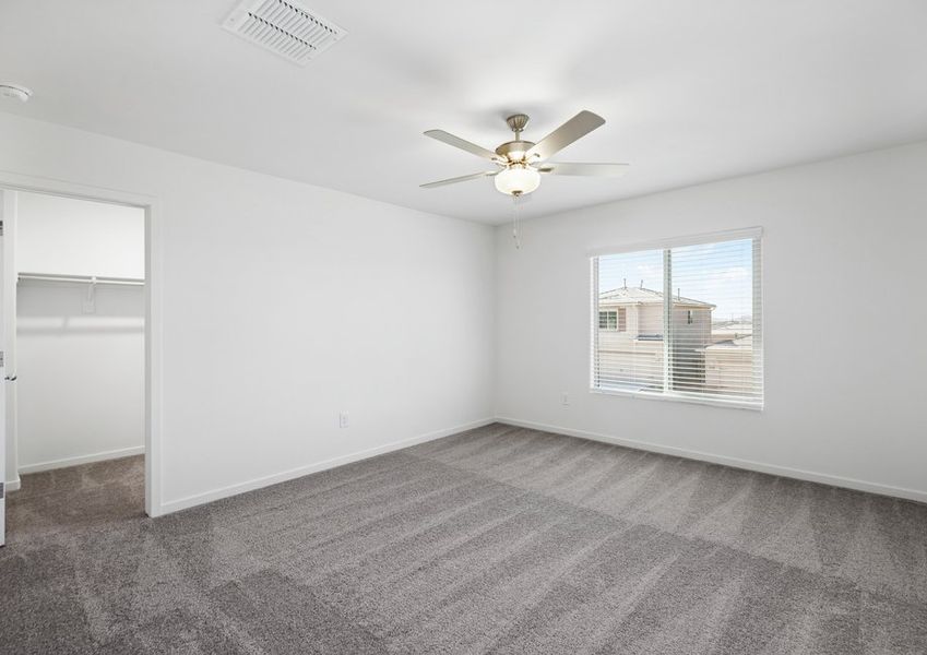 The master bedroom has tons of natural light, bringing a warm atmosphere.