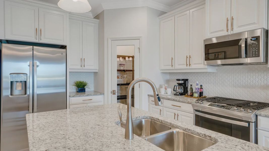Representative furnished interior of a home built from the Dream 2 by Neal Communities in SkySail, Naples (Image 14).
