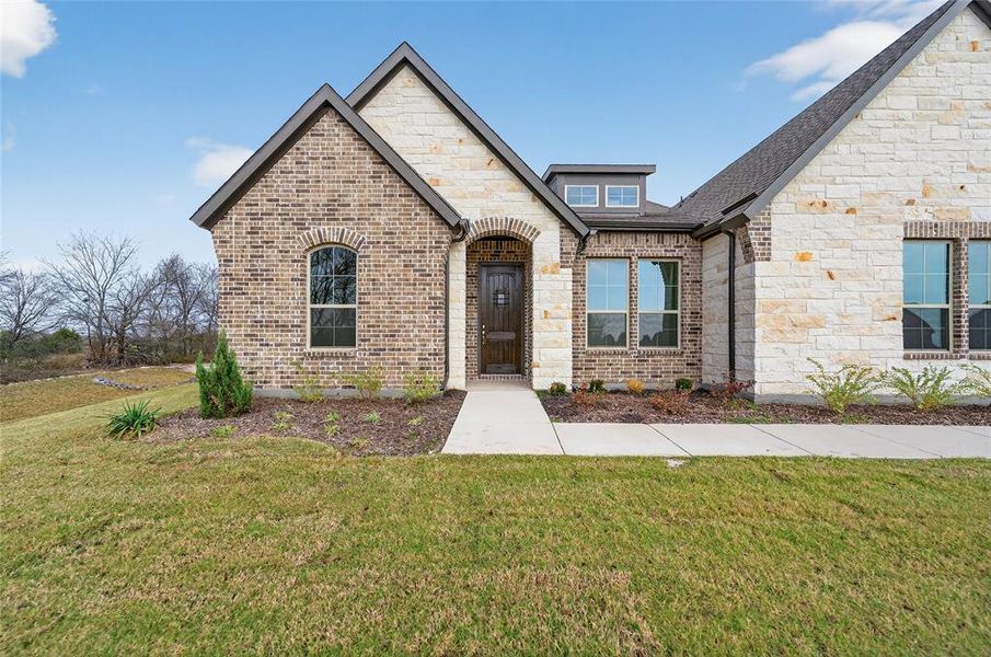 Front exterior of a new home in Nash Estates, Tom Bean, TX, highlighting curb appeal (Image 27).