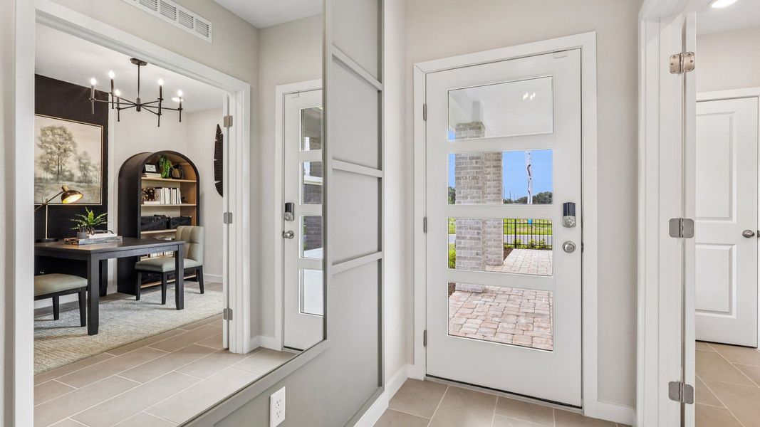 Flagler Floor Plan in Modern Elevation Door with a flex space staged as a study to the left of entry Flagler Floor Plan in Modern Elevation Door with a flex space staged as a study to the left of entry