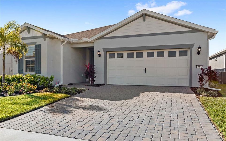 Front exterior of a new home in , Winter Garden, FL, highlighting curb appeal (Image 1).