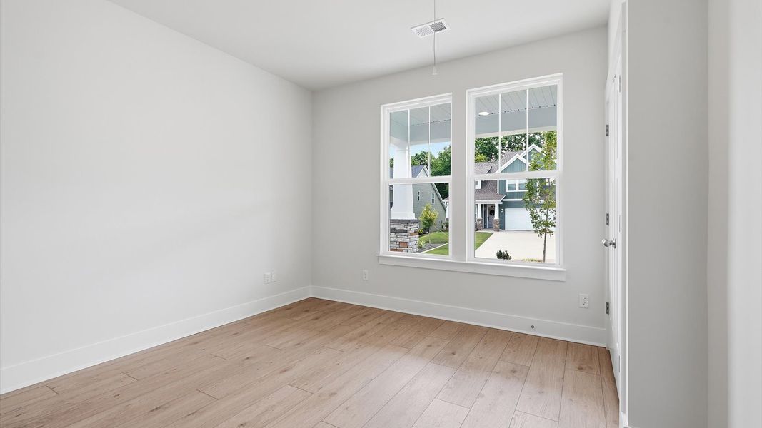 Inviting bedroom with tasteful finishes and large windows that create a fresh, open ambiance in Moore, SC Inviting bedroom with tasteful finishes and large windows that create a fresh, open ambiance in Moore, SC