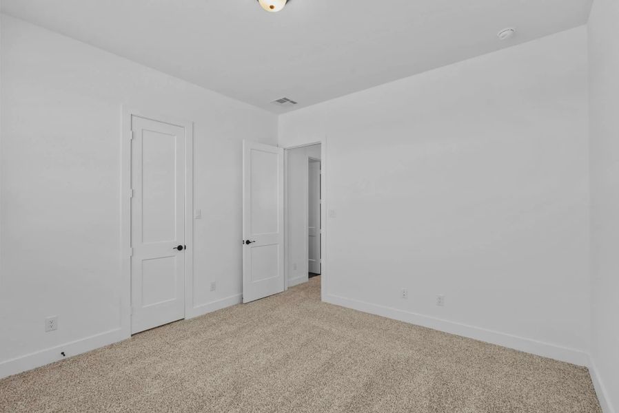 Representative unfurnished interior of a home built from the Nicklaus by Chesmar Homes in Riceland Alley Loads, Mont Belvieu (Image 55).