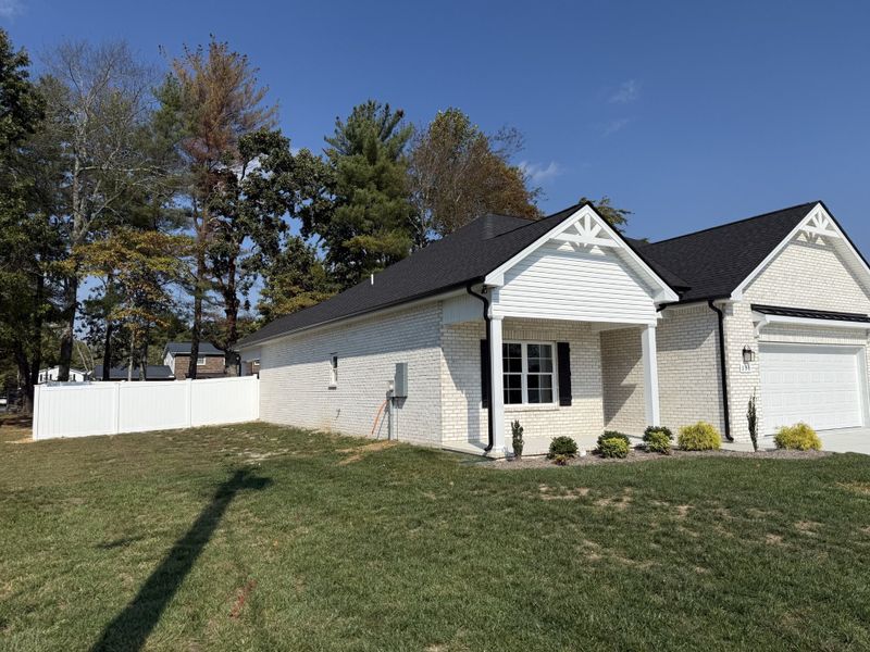 Front exterior of a new home in Fox Run, Manchester, TN, highlighting curb appeal (Image 20).