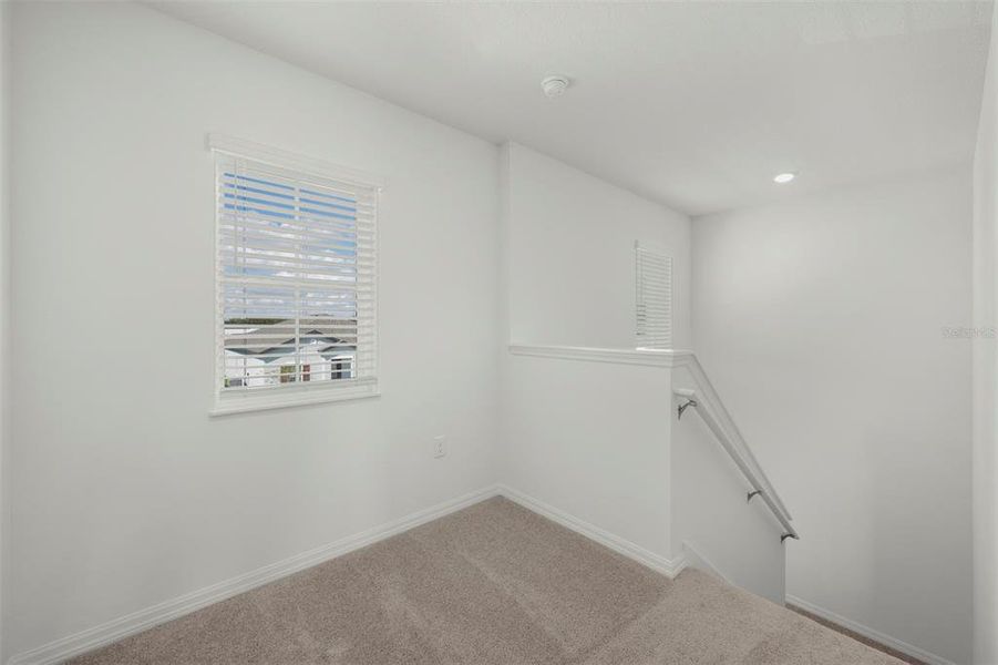 Spacious, unfurnished interior of a new home in Peach Crossings, Winter Haven (Image 30).