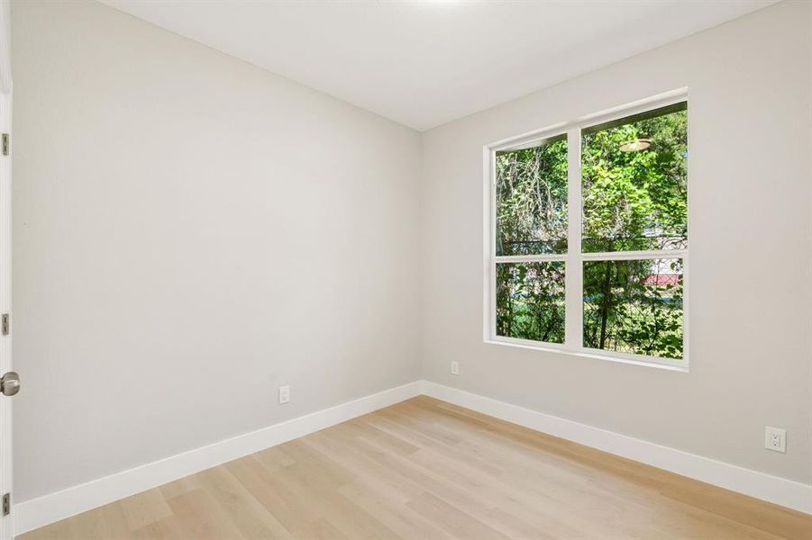 Light-toned wood-finish flooring complements the neutral wall color Light-toned wood-finish flooring complements the neutral wall color