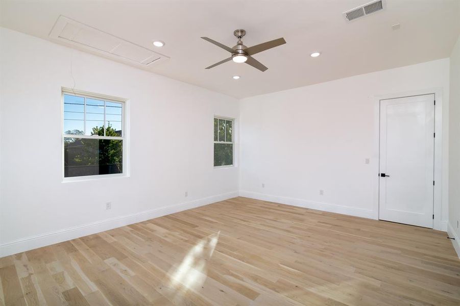 Spare room featuring light hardwood / wood-style flooring and ceiling fan