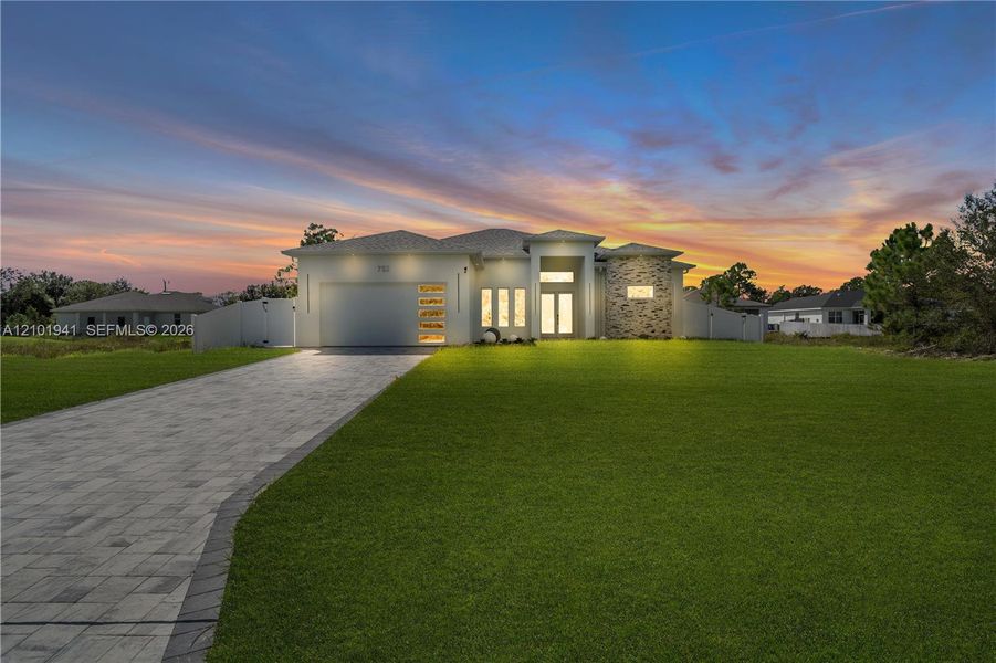 Front exterior of a new home in , Lehigh Acres, FL, highlighting curb appeal (Image 21).