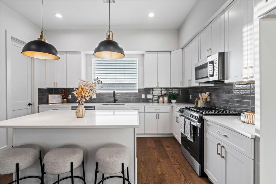 The island provides extra room to work, making the kitchen more spacious and cooking more efficient.