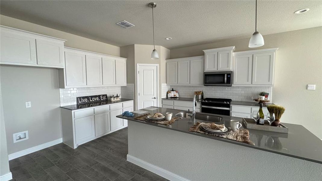 Kitchen - All Home and community information, including pricing, included features, terms, availability and amenities, are subject to change at any time without notice or obligation. All Drawings, pictures, photographs, video, square footages, floor plans, elevations, features, colors and sizes are approximate for illustration purposes only and will vary from the homes as built.