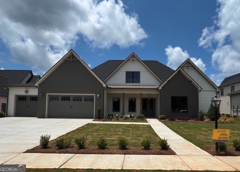 Front exterior of a new home in Mill Farms, Peachtree City, GA, highlighting curb appeal (Image 1).