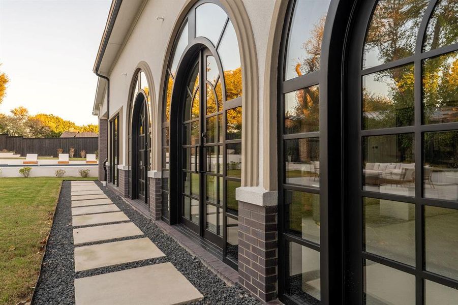 View of exterior entry with stucco siding