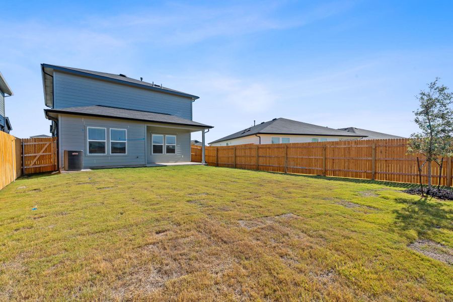 Rear view of house featuring a patio and a fenced backyard Rear view of house featuring a patio and a fenced backyard