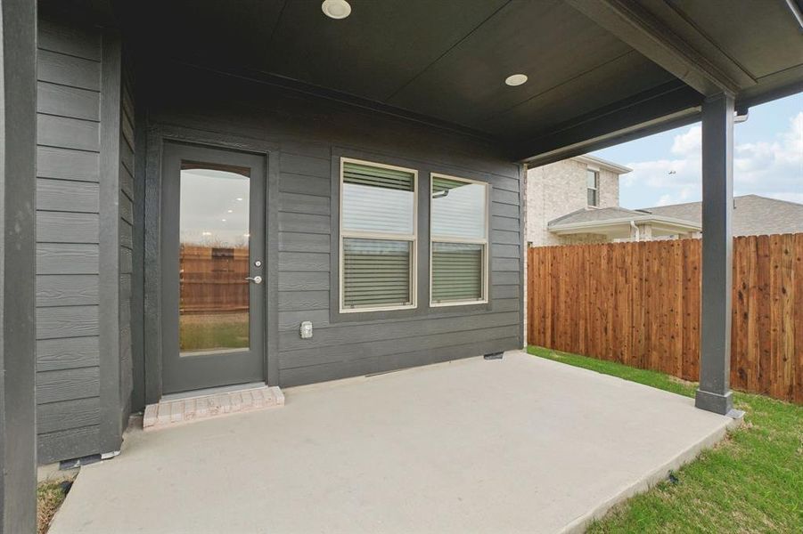 Exterior details and patio area of a home in Parks at Foster Crossing - Spring Series, Anna (Image 24).