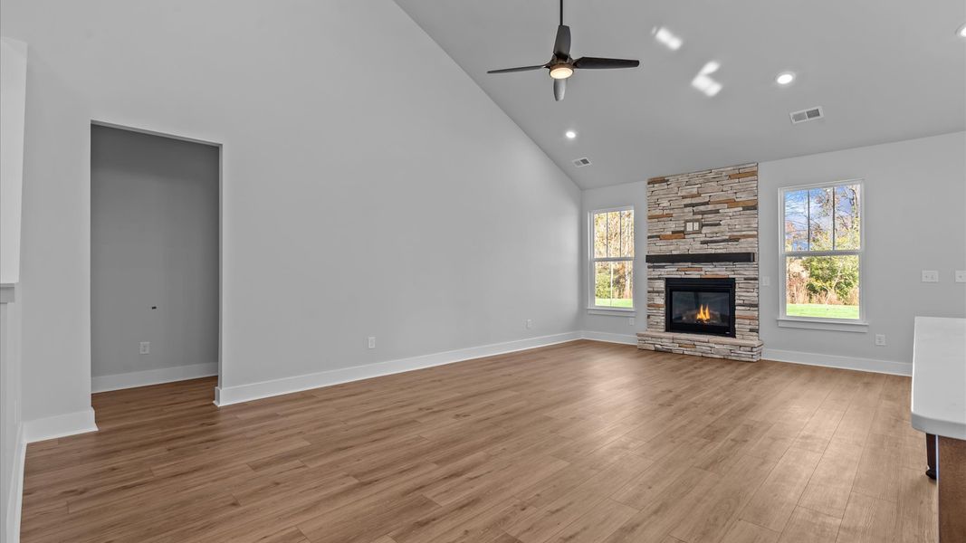 Notable two-story family room with fireplace offering a grand yet inviting space for memorable everyday living