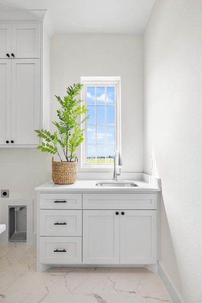 Utility room with washer/dryer connections Utility room with washer/dryer connections