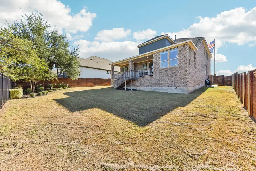 Exterior details and patio area of a home in Provence 70s, Austin (Image 3).
