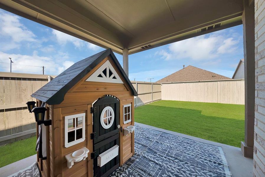 Exterior details and patio area of a home in Pecan Square, Northlake (Image 23).