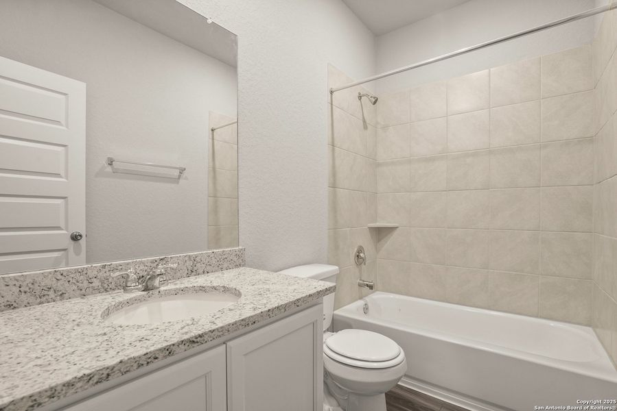 Furnished interior view inside a new home in Cinco Lakes, San Antonio (Image 7).