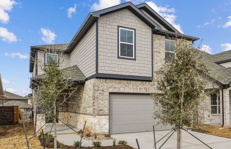 Front exterior of a new home in Horizon Lake, Leander, TX, highlighting curb appeal (Image 21).