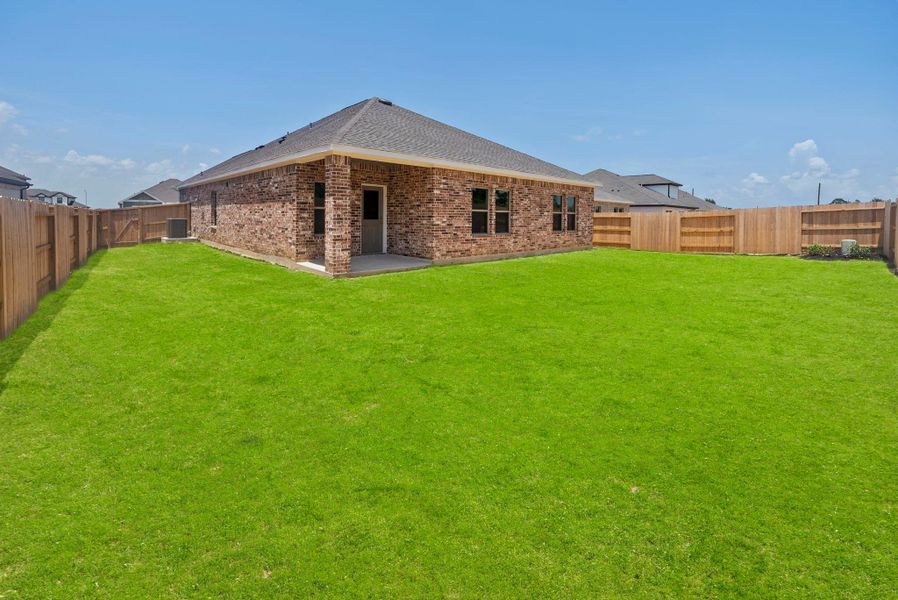 Exterior details and patio area of a home in Windcress, Cove (Image 4).