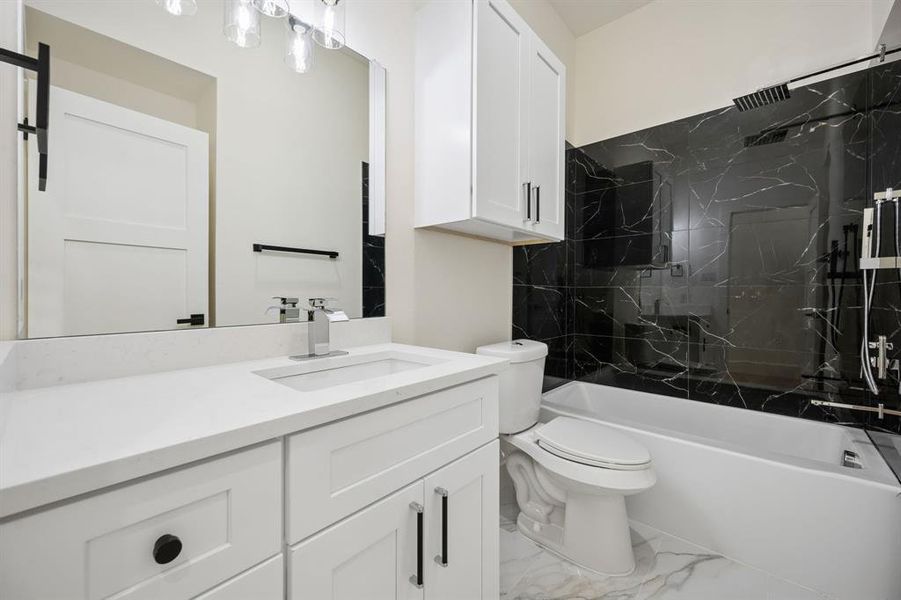 Bathroom featuring vanity and gorgeous shower wall and floor surfaces.