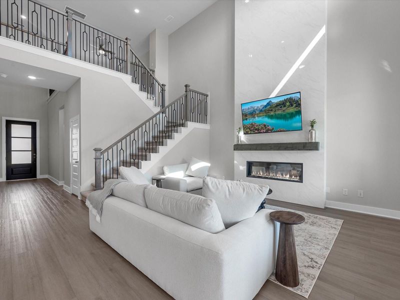 Open ceilings, iron wrought staircase spindles, and LVP flooring Open ceilings, iron wrought staircase spindles, and LVP flooring