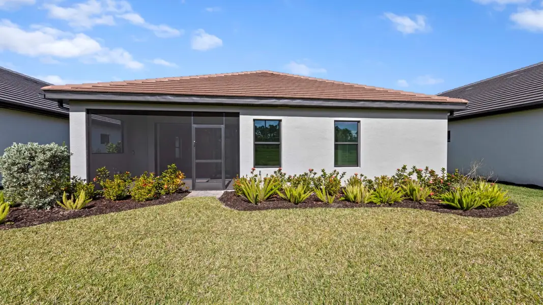 Exterior details and patio area of a home in SkySail, Naples (Image 4).