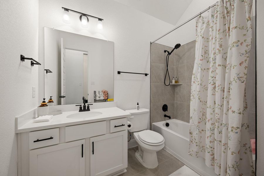 A pristine full bathroom with contemporary finishes and a spacious vanity. A pristine full bathroom with contemporary finishes and a spacious vanity.