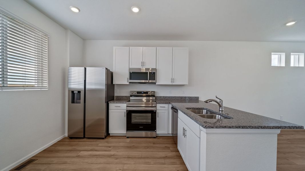 Furnished interior view inside a new home in Reunion, Commerce City (Image 3).