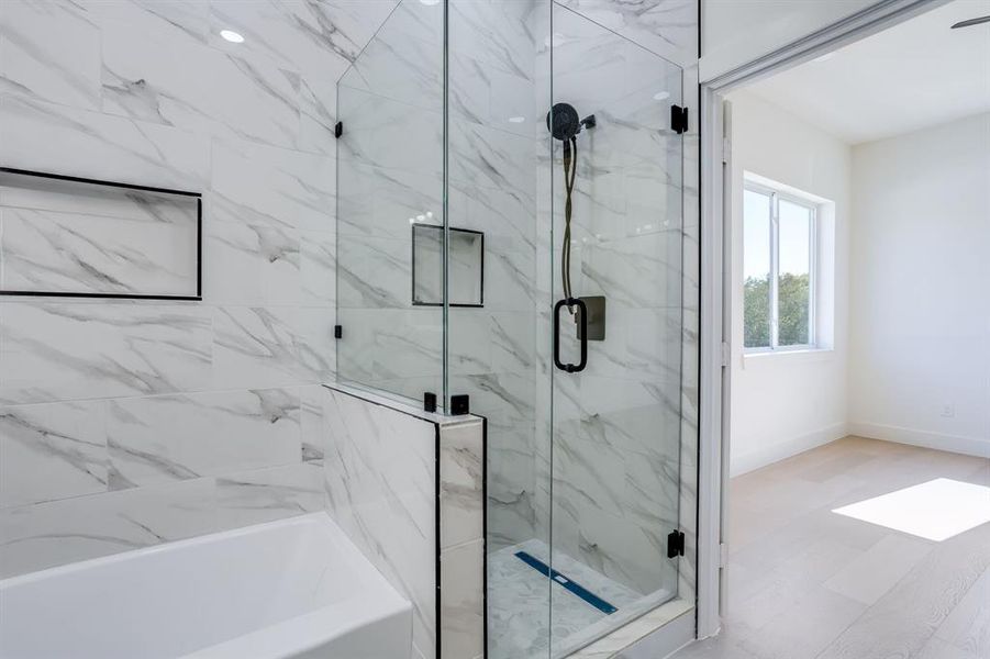 Full bath with a bathtub and a marble finish shower