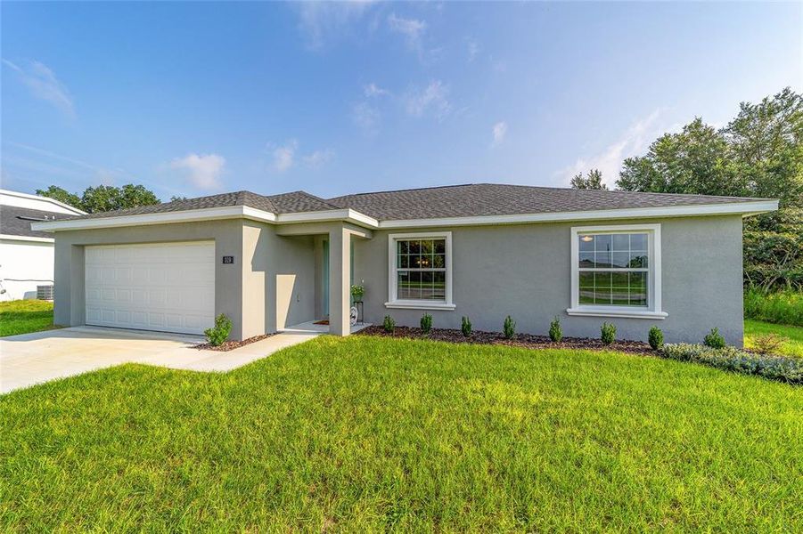 Front exterior of a new home in , Ocala, FL, highlighting curb appeal (Image 1). Front exterior of a new home in , Ocala, FL, highlighting curb appeal (Image 1).