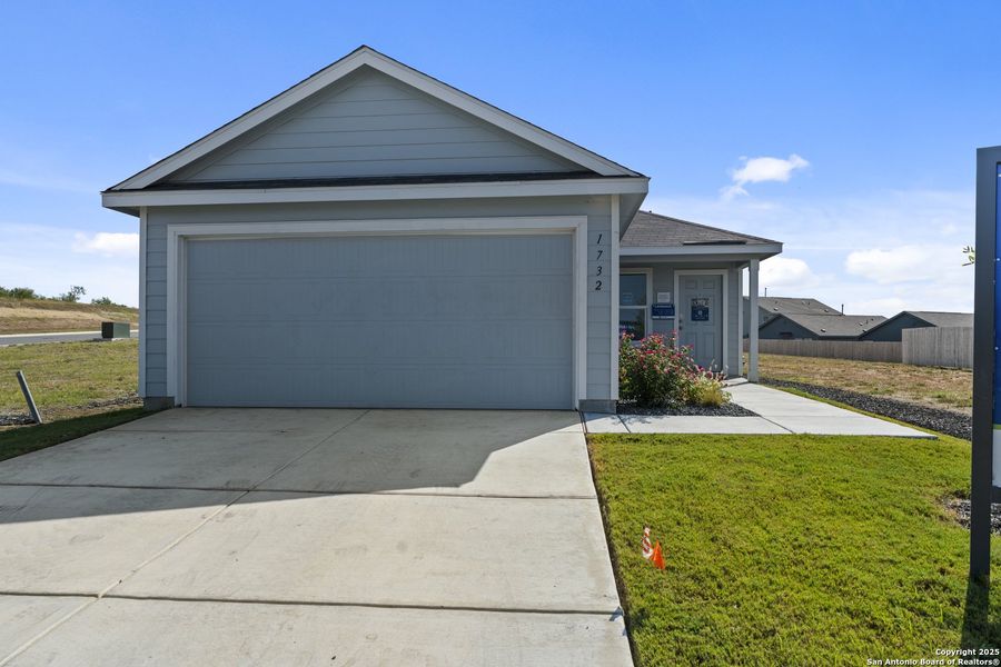 Front exterior of a new home in , New Braunfels, TX, highlighting curb appeal (Image 1).
