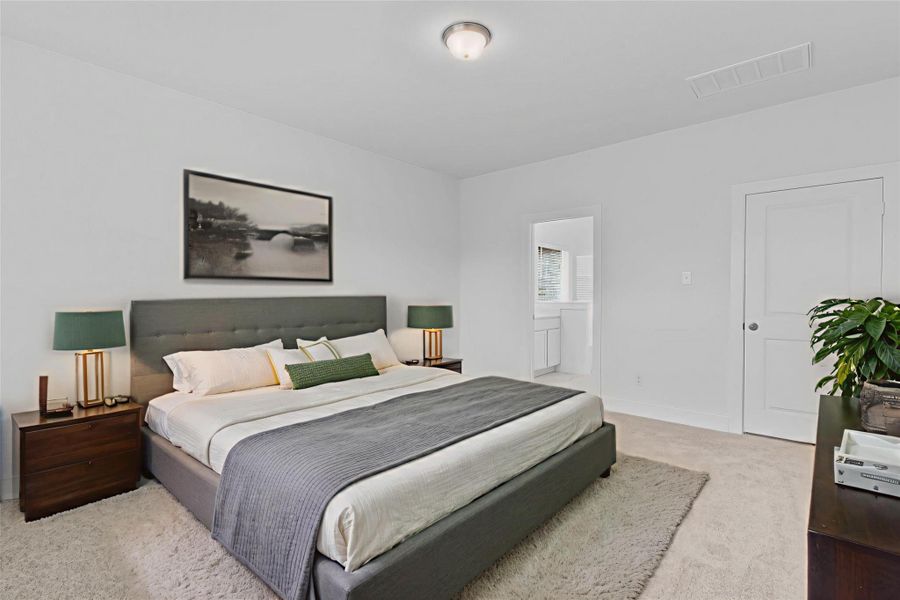 Another view of the primary suite showcasing its generous size and direct access to the spa-like bathroom. *Virtually Staged* **Image Representative of Plan Only and May Vary as Built**.