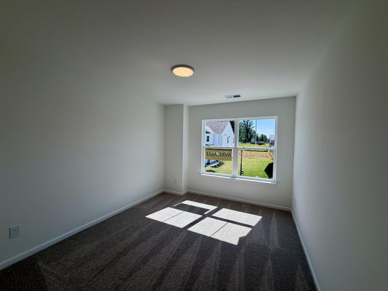 Spacious, unfurnished interior of a new home in Bellevue Townhomes, Greenville (Image 11).