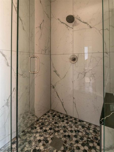 Bathroom with a shower with door